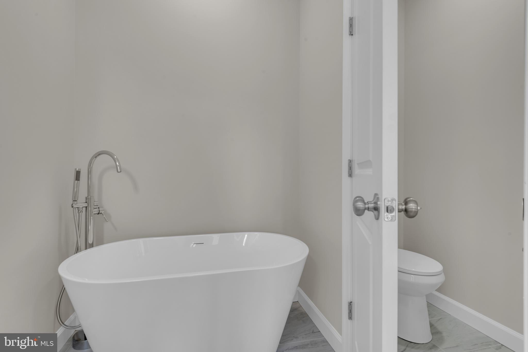 9912 Ridge Street Glenn Dale, MD 20769 - Photo 37 of 60 Soak tub with floor mounted faucet and wand