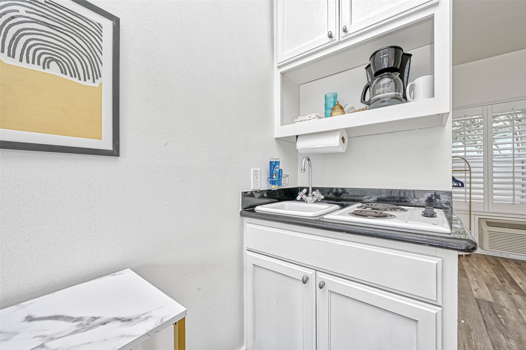 2112 Harold Street Houston, TX 77098 - Photo 12 of 16 Kitchen area has 2 burner cooktop, granite countertop, sink and refrigerator.