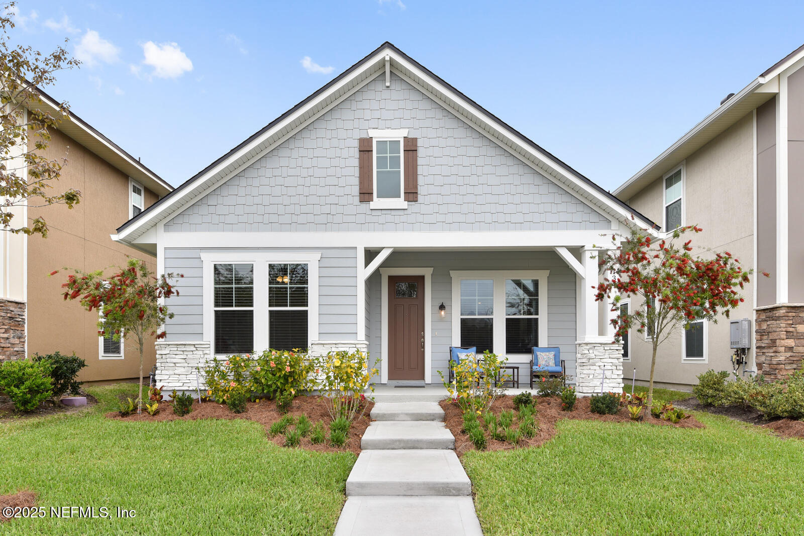a front view of house with yard and green space