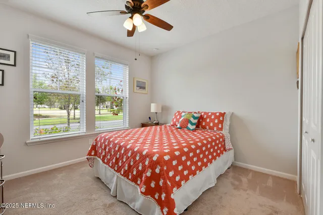 a bedroom with a bed and window