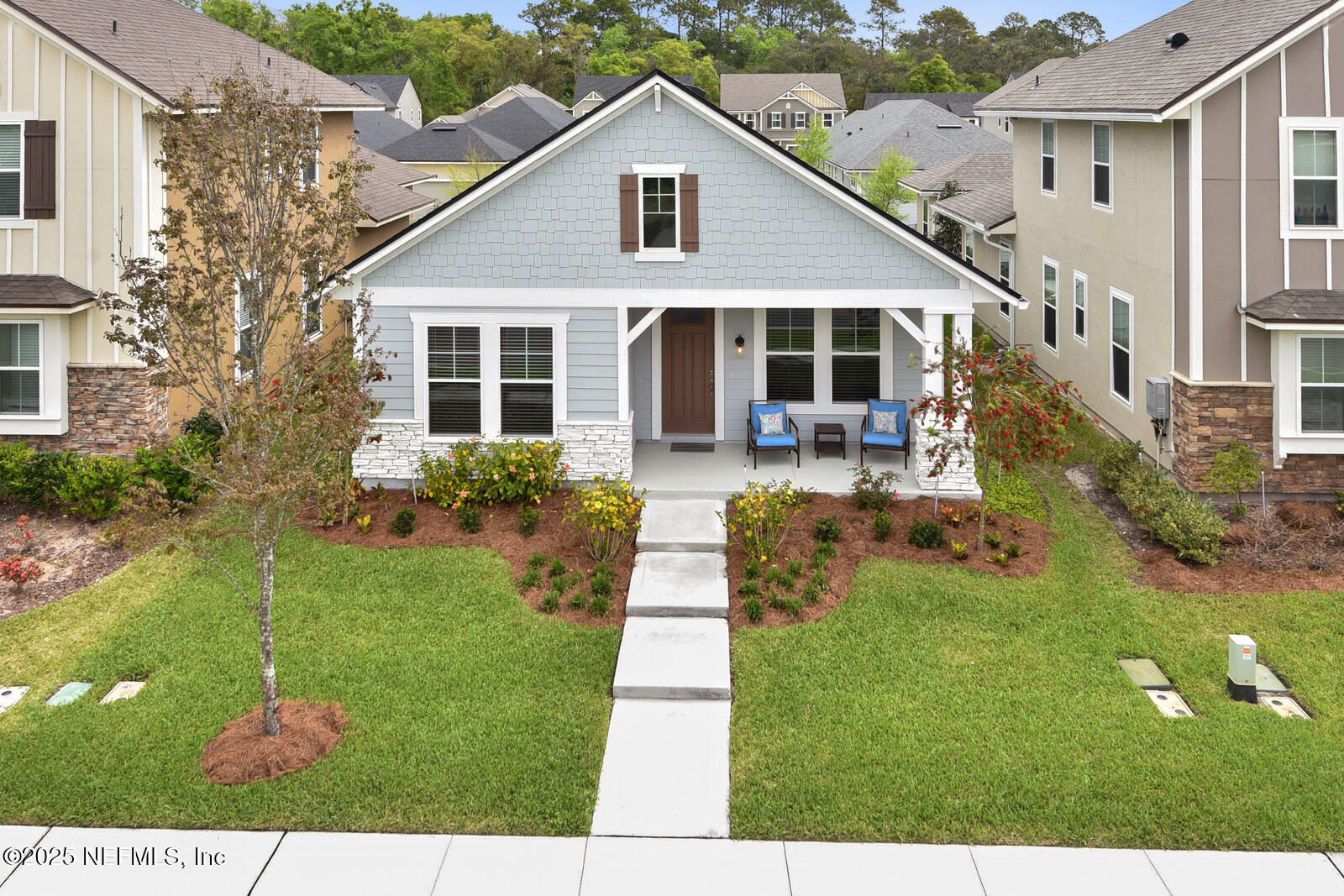 134 Jackrabbit Trail Ponte Vedra, FL 32081 - Photo 3 of 26 a front view of a house with garden
