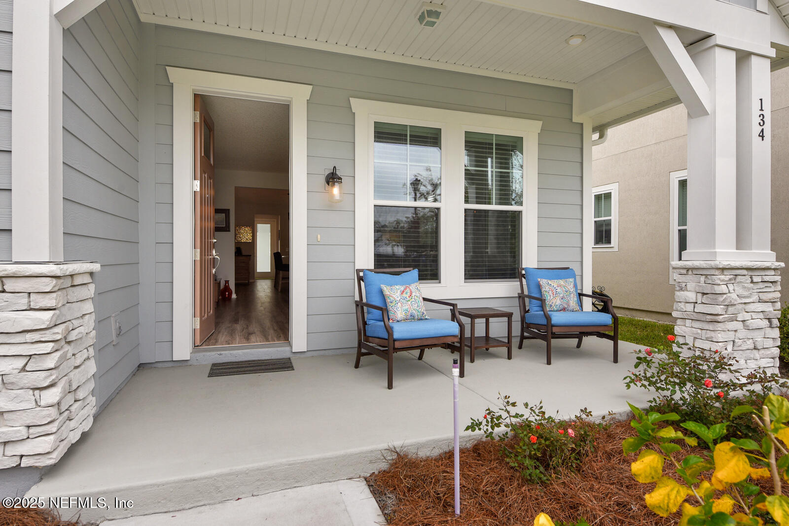 134 Jackrabbit Trail Ponte Vedra, FL 32081 - Photo 4 of 26 a view of a house with backyard sitting area and garden