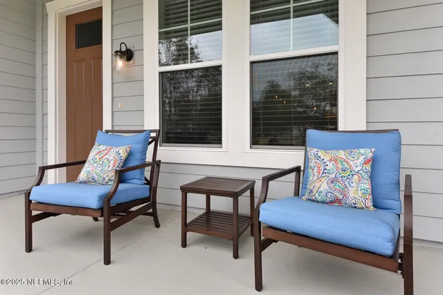 a outdoor living space with furniture and a rug