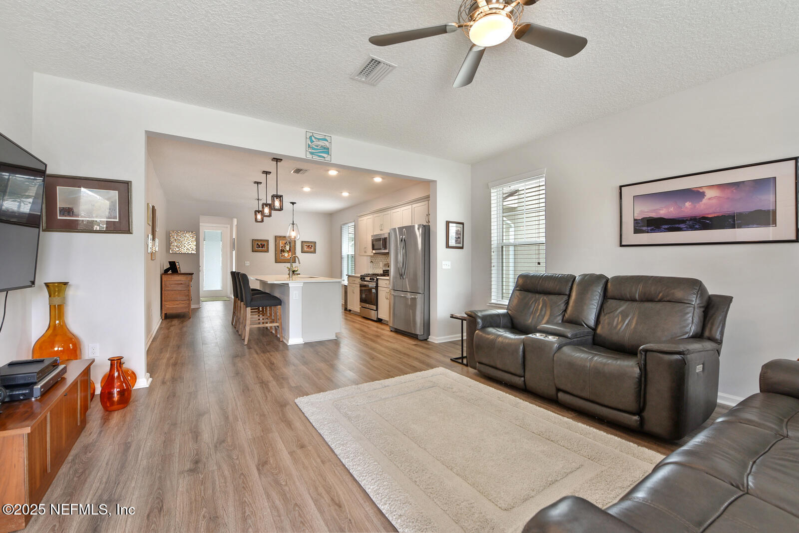 134 Jackrabbit Trail Ponte Vedra, FL 32081 - Photo 6 of 26 a living room with furniture and a view of kitchen