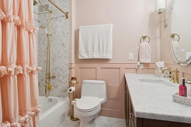 a bathroom with a toilet and a bathtub