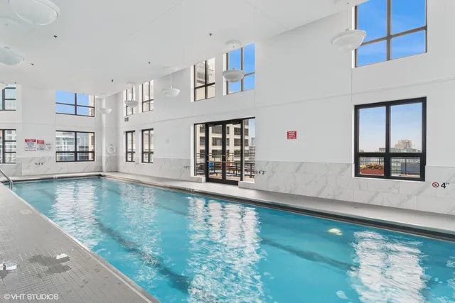a roof deck with a table and chairs