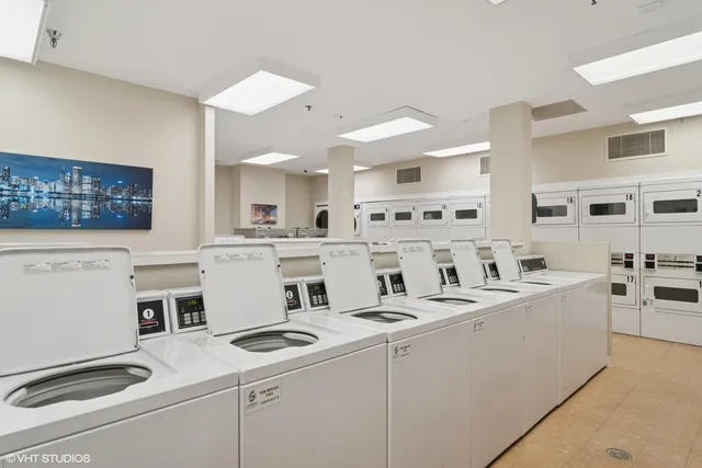 a view of parking garage with cars parked