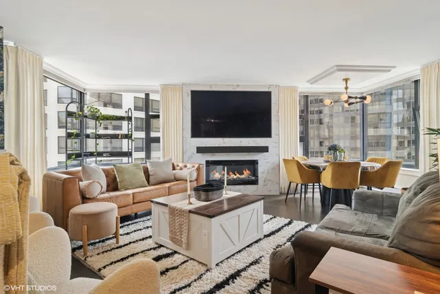 a living room with furniture and large window
