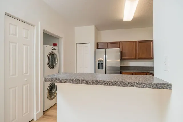 a utility room with washer and dryer