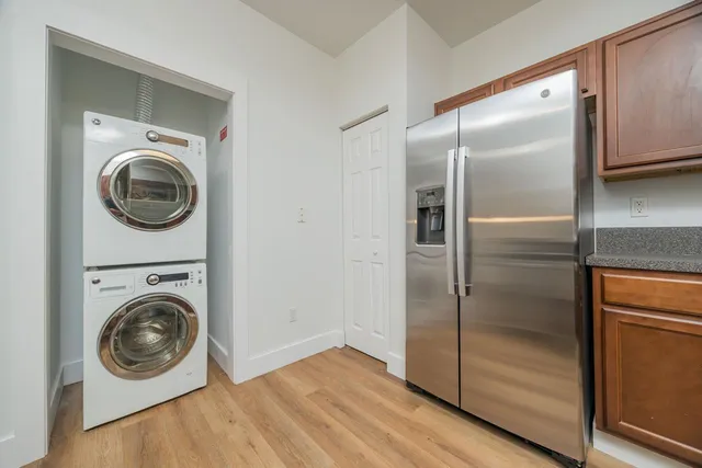 a view of a hallway with washer and dryer
