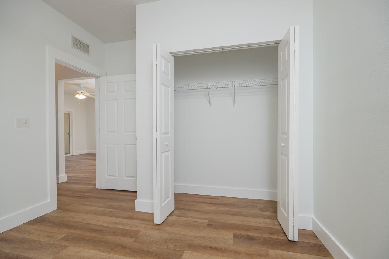 2310 Golden Lake Loop St. Augustine, FL 32084 - Photo 24 of 34 an empty room with wooden floor & closet area