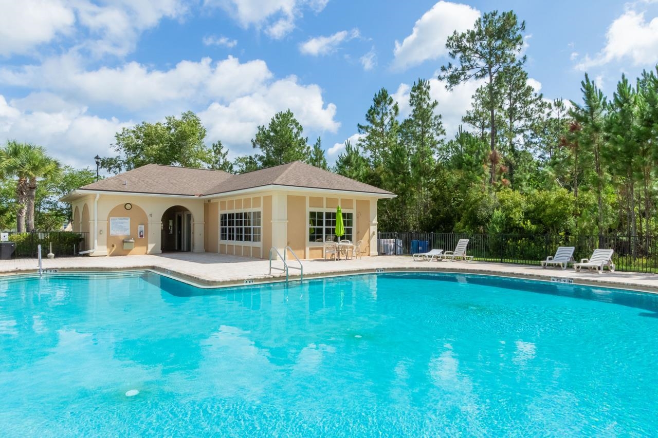 2310 Golden Lake Loop St. Augustine, FL 32084 - Photo 32 of 34 a front view of house with yard and swimming pool
