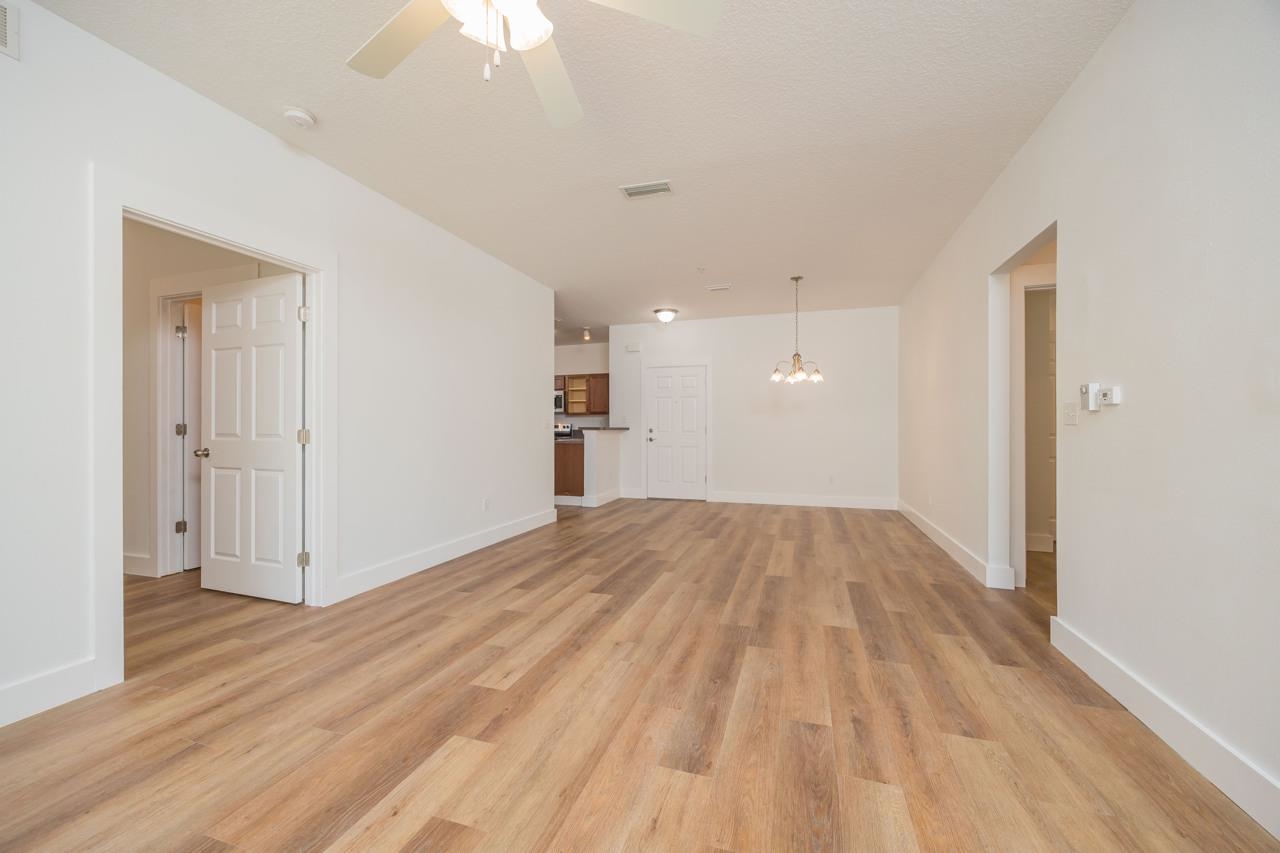 2310 Golden Lake Loop St. Augustine, FL 32084 - Photo 9 of 34 a view of empty room with wooden floor