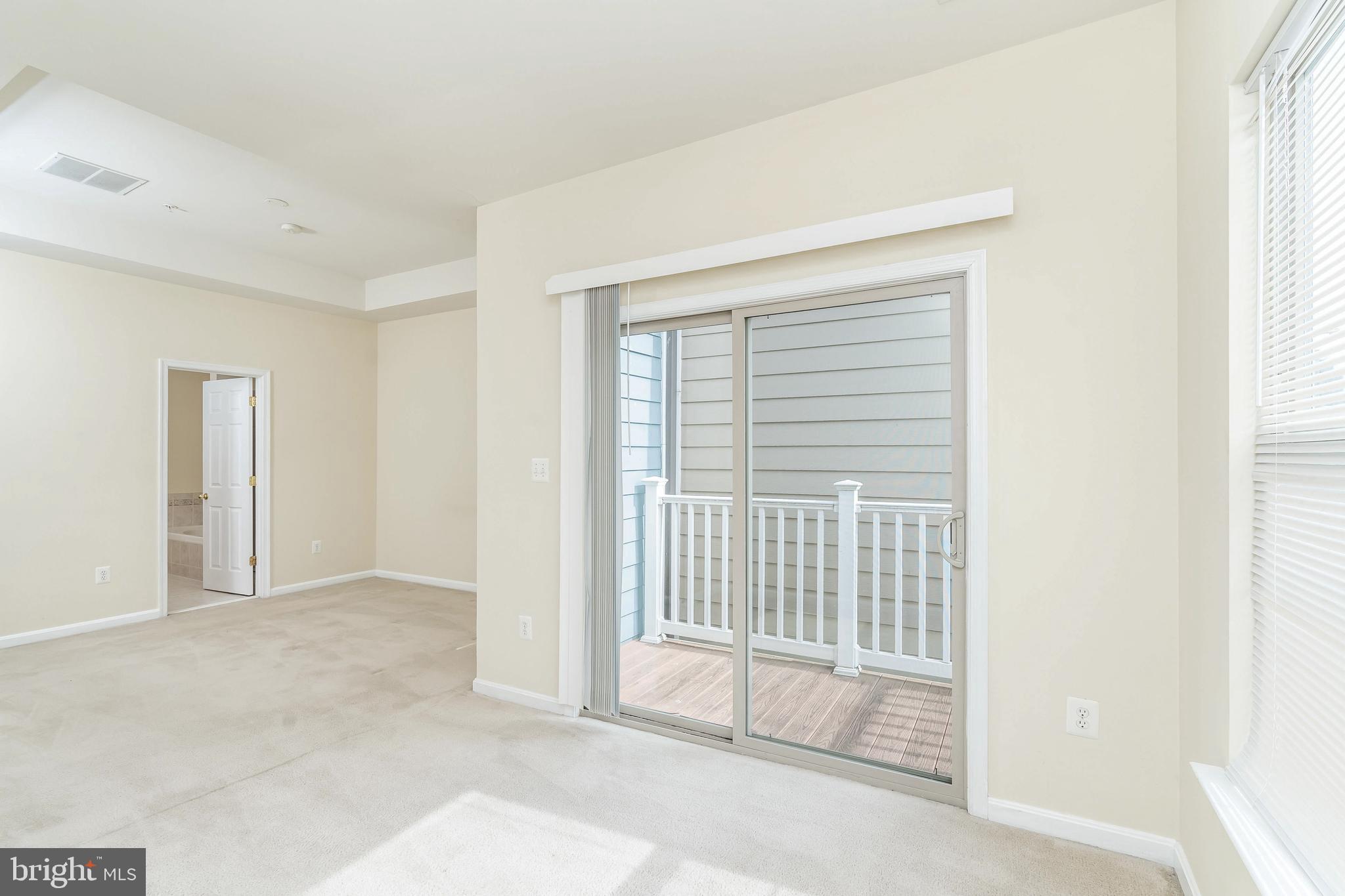8 South Exeter Street, Unit 142 Baltimore, MD 21202 - Photo 30 of 43 Sitting area opens to Deck