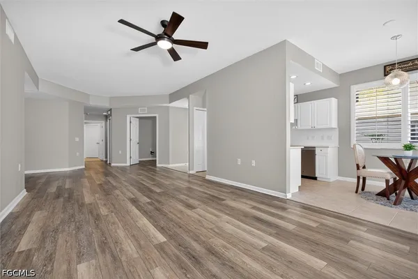 a view of livingroom with hardwood floor and a ceiling fan