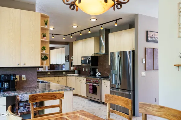 a bathroom with a sink vanity and a mirror