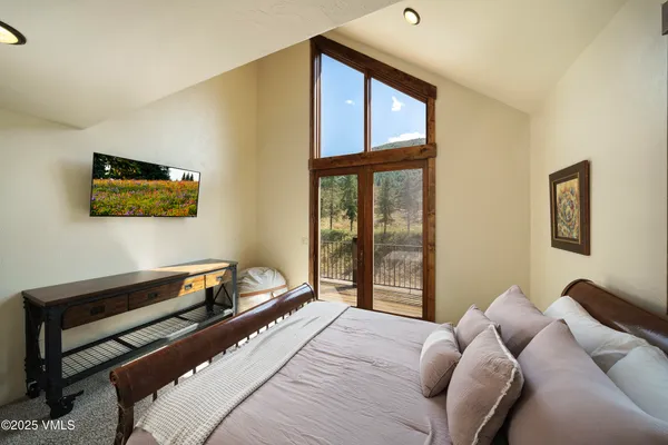 a view of a chairs and table in the balcony