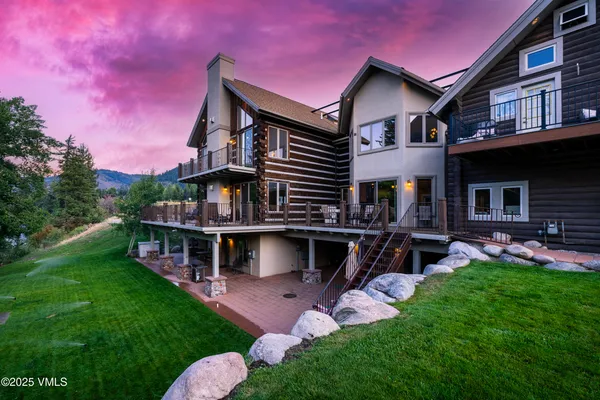 a kitchen with stainless steel appliances granite countertop a refrigerator a stove a sink and a microwave