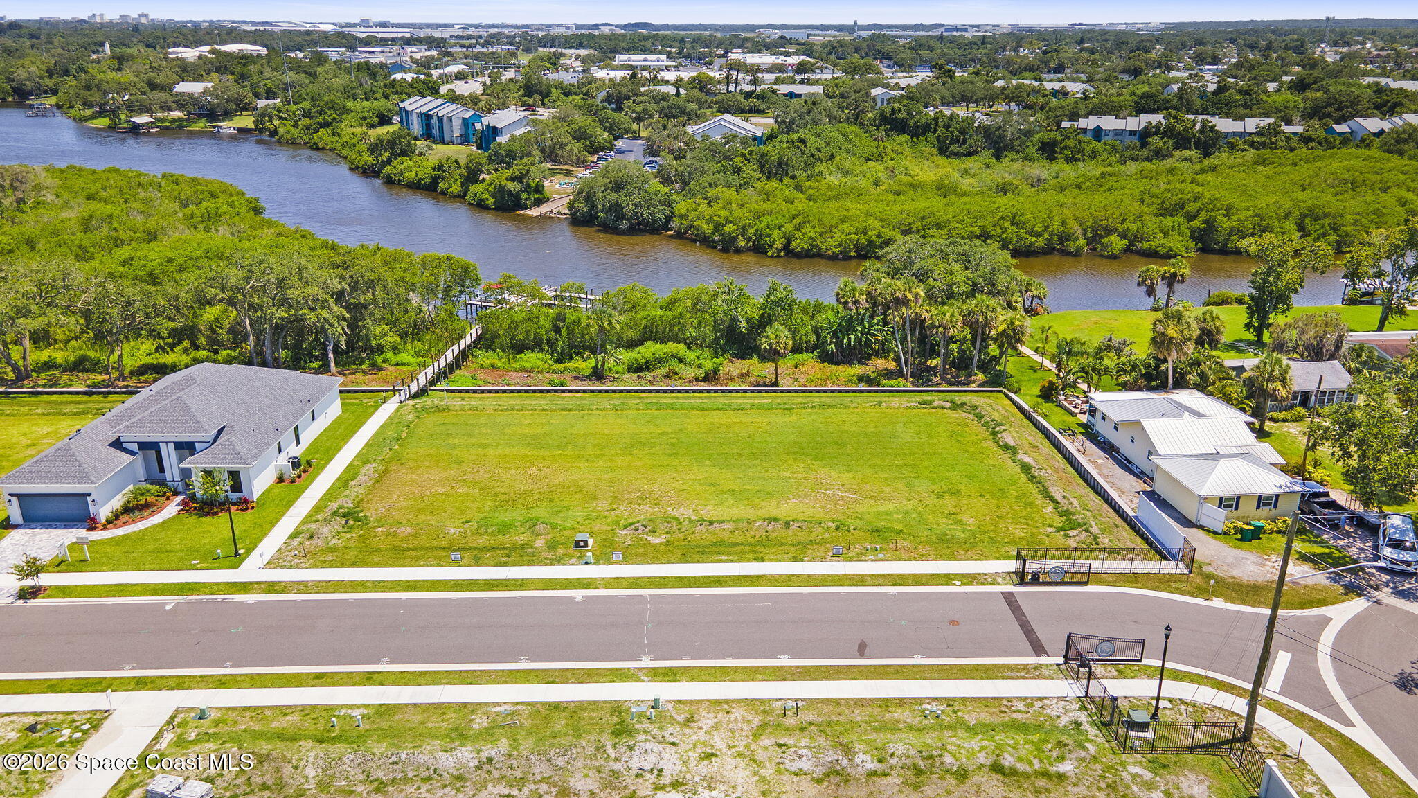 1465 Windchime Lane Melbourne, FL 32935 - Photo 12 of 17 an aerial view of a house with a swimming pool and mountains