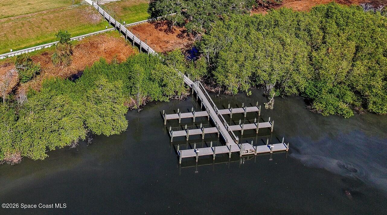 1465 Windchime Lane Melbourne, FL 32935 - Photo 16 of 17 a view of an outdoor space with seating area