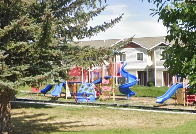 a view of small pond with swimming pool