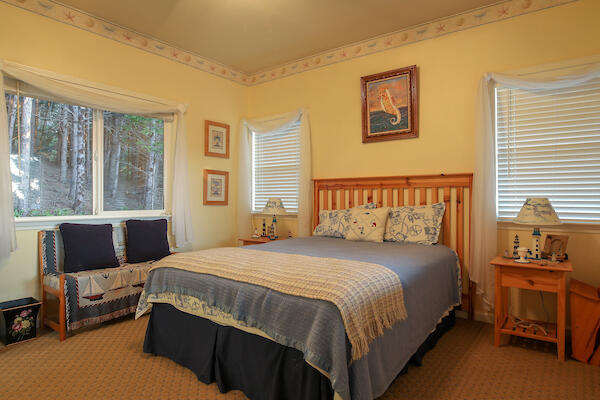 1050 Spring Road Shelter Cove, CA 95589 - Photo 25 of 42 a bedroom with a bed and a couch