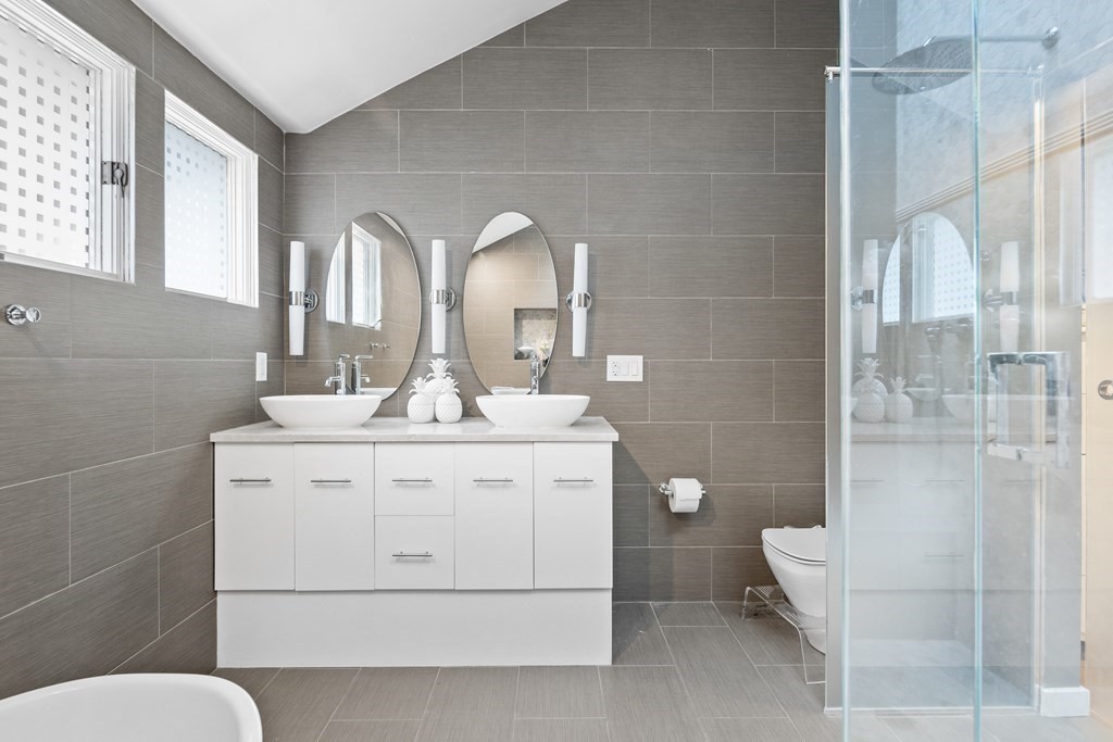 106 Windsor Road Needham, MA 02492 - Photo 11 of 37 a bathroom with a toilet sink and shower