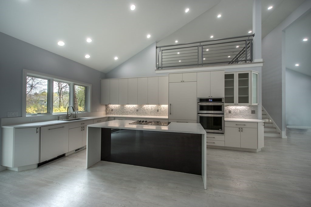 106 Windsor Road Needham, MA 02492 - Photo 17 of 37 a kitchen with sink cabinets and stainless steel appliances