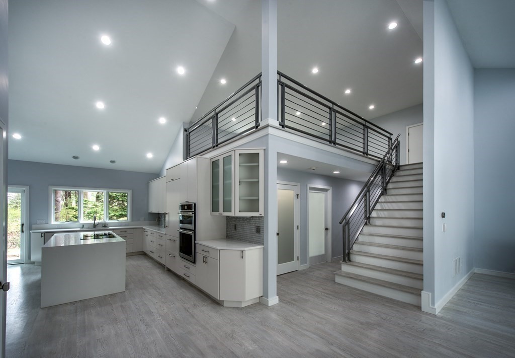 106 Windsor Road Needham, MA 02492 - Photo 18 of 37 an entryway in a hall with a window and wooden floor