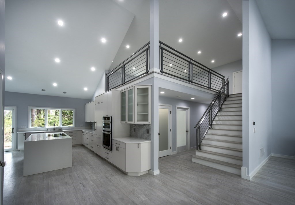 106 Windsor Road Needham, MA 02492 - Photo 20 of 37 an entryway in a hall with a window and wooden floor