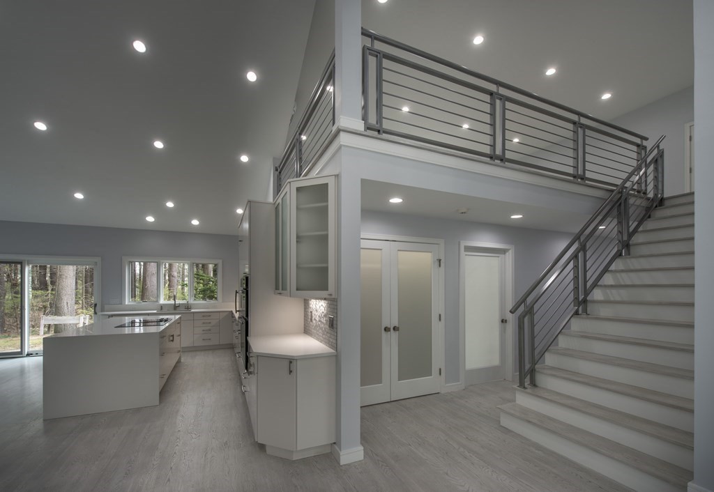 106 Windsor Road Needham, MA 02492 - Photo 22 of 37 a view of a big room with kitchen and chandelier