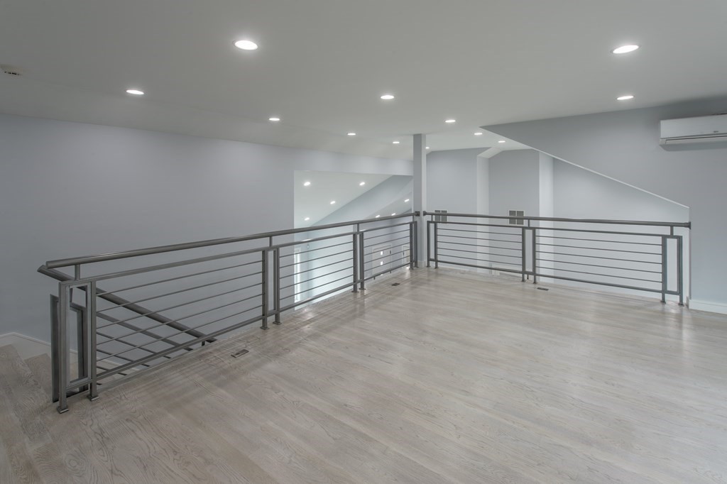 106 Windsor Road Needham, MA 02492 - Photo 24 of 37 a view of a hall with stairs