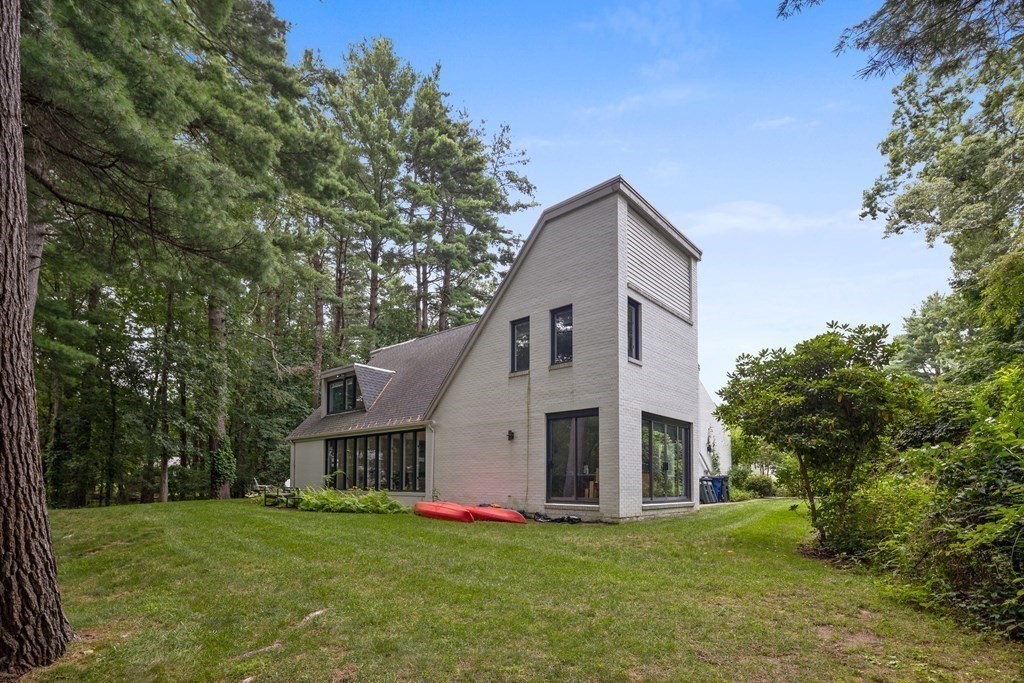 106 Windsor Road Needham, MA 02492 - Photo 30 of 37 a front view of house with yard and trees