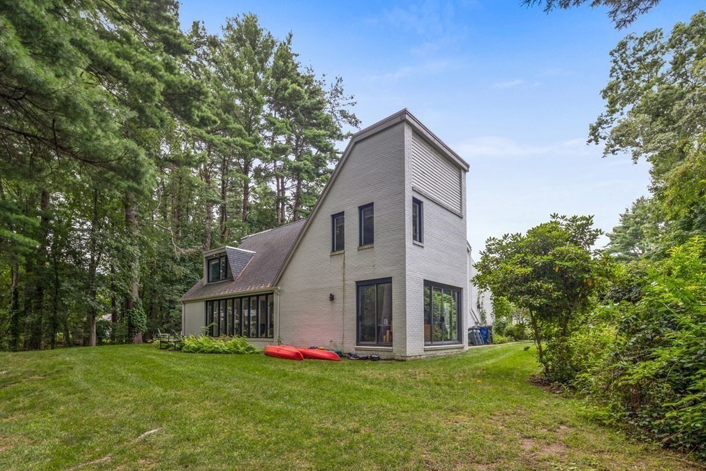 106 Windsor Road Needham, MA 02492 - Photo 31 of 37 a view of a house with a yard