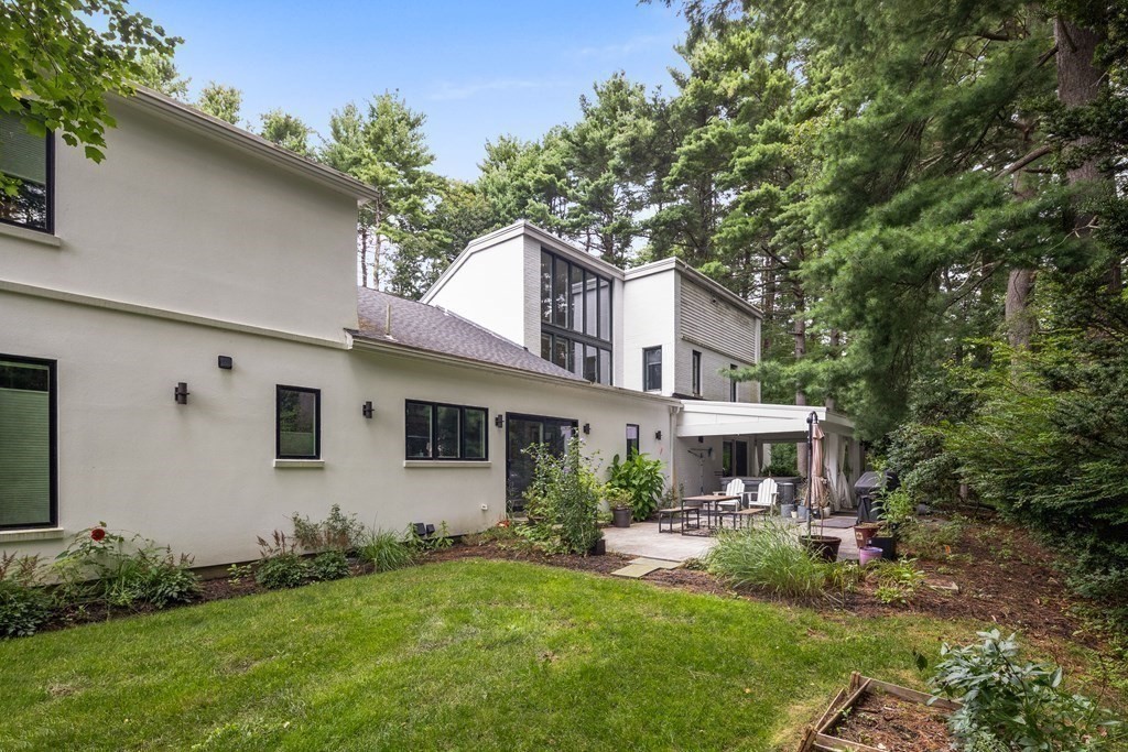106 Windsor Road Needham, MA 02492 - Photo 34 of 37 a front view of a house with a yard and porch