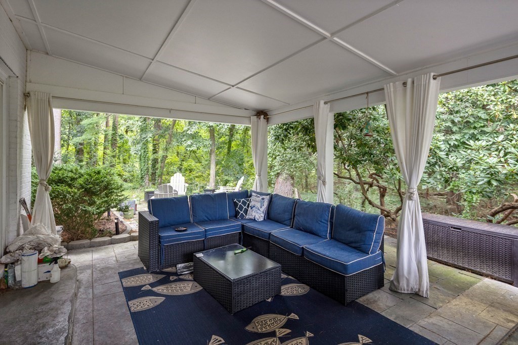 106 Windsor Road Needham, MA 02492 - Photo 36 of 37 a living room with furniture and a large window