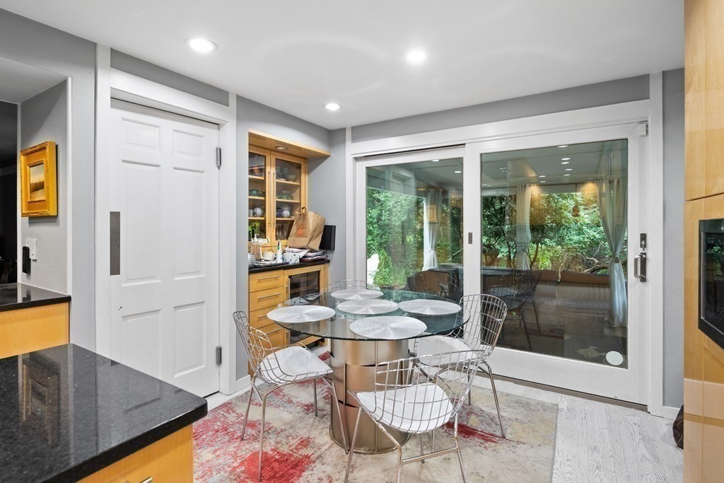 106 Windsor Road Needham, MA 02492 - Photo 8 of 37 a dining room with furniture and a floor to ceiling window