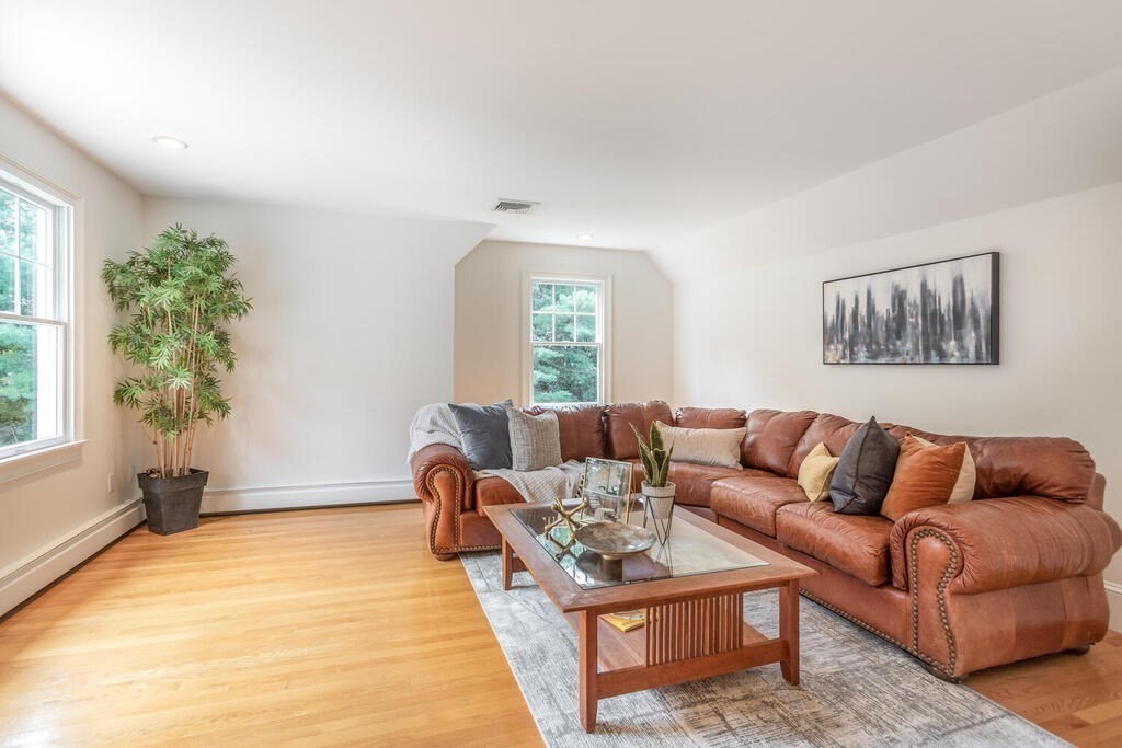 4 Hampton Road Lexington, MA 02421 - Photo 21 of 30 a living room with furniture and a potted plant