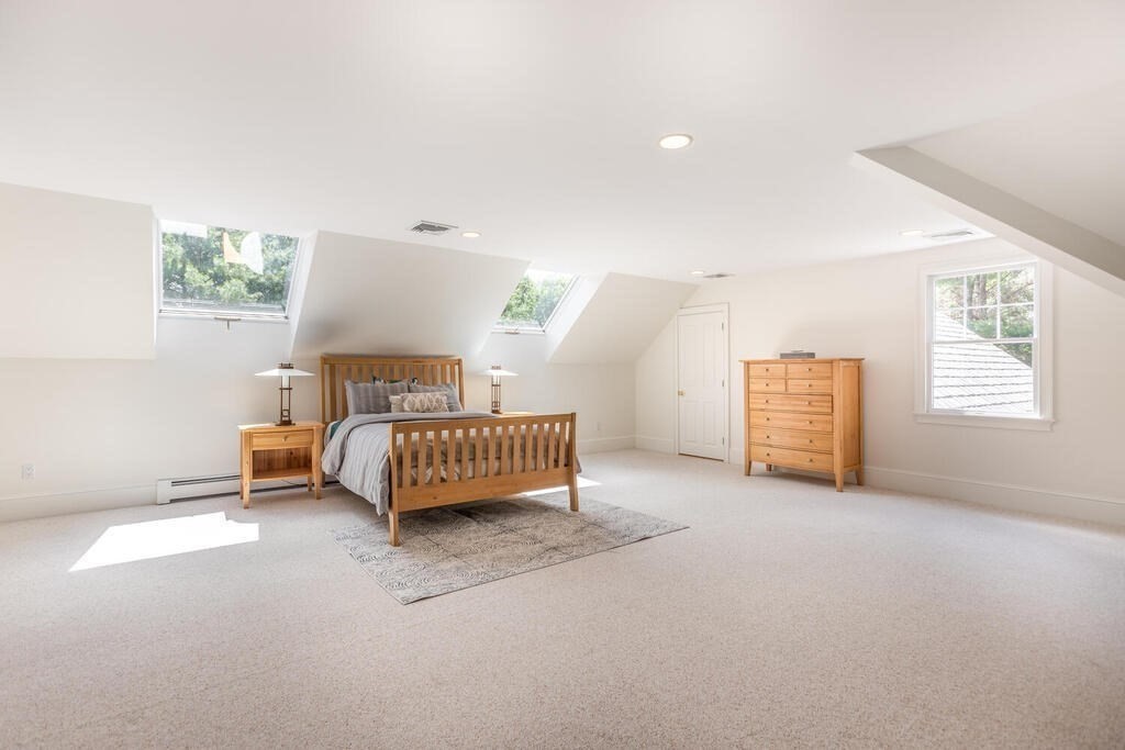 4 Hampton Road Lexington, MA 02421 - Photo 23 of 30 a bedroom with a bed and a lamp