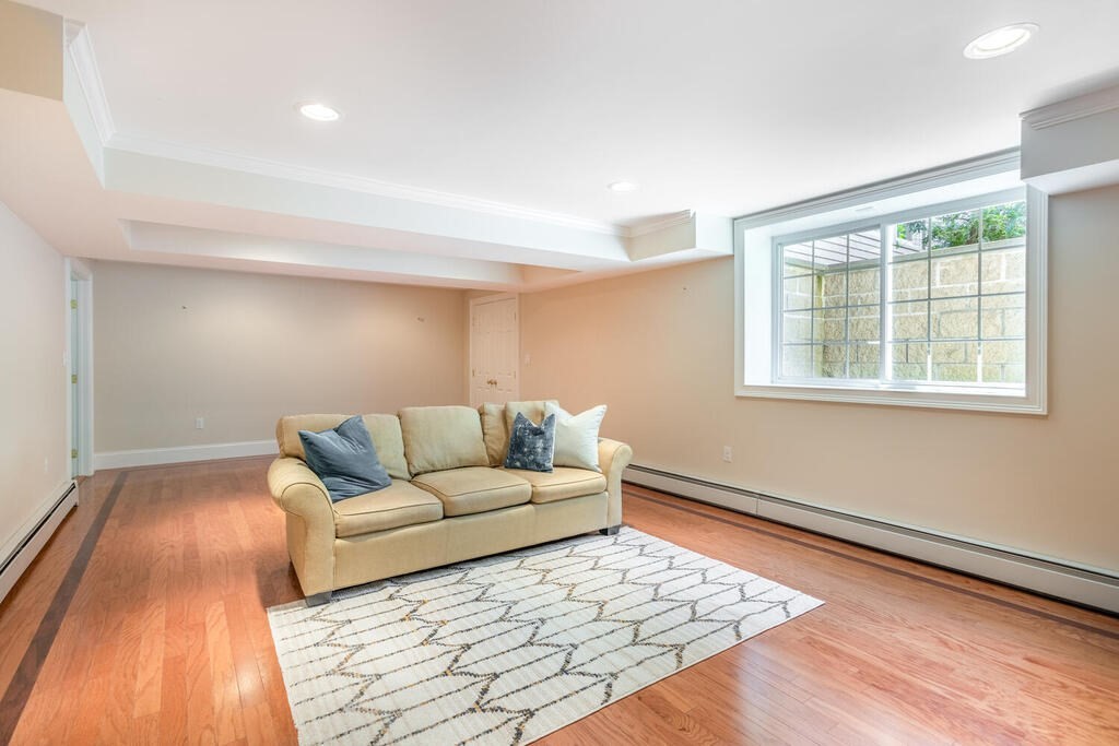 4 Hampton Road Lexington, MA 02421 - Photo 27 of 30 a living room with furniture and a rug