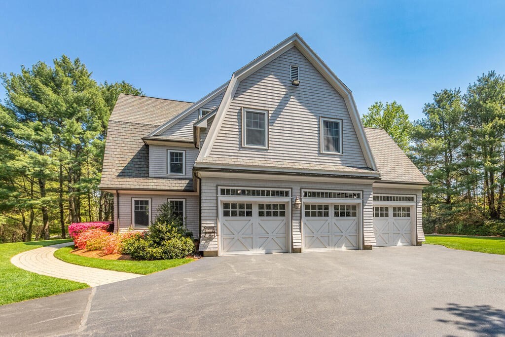 4 Hampton Road Lexington, MA 02421 - Photo 3 of 30 a front view of a house with a garden and porch