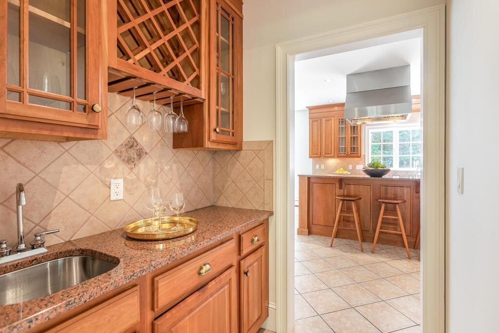 4 Hampton Road Lexington, MA 02421 - Photo 8 of 30 a kitchen with a sink and cabinets