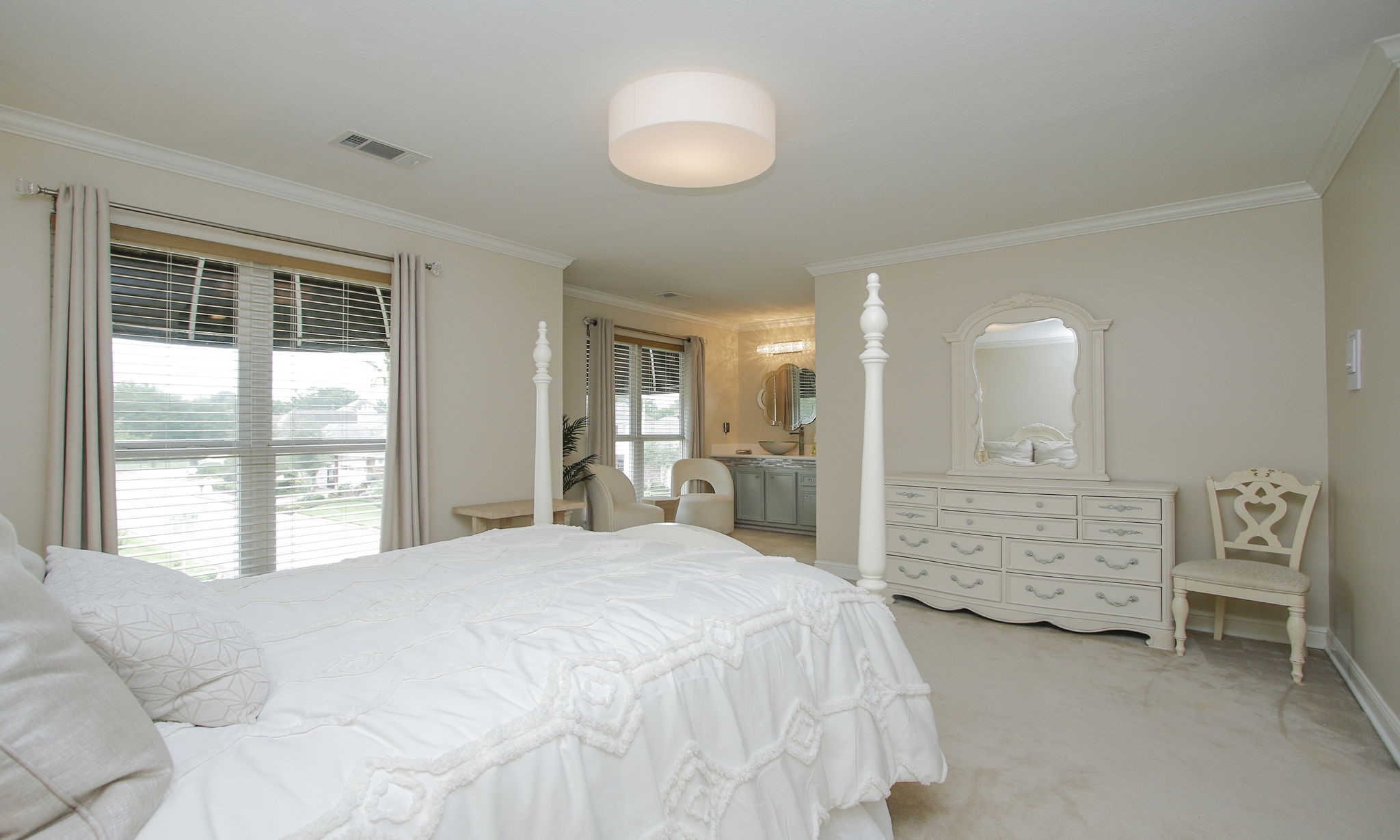 16610 Manningtree Lane Spring, TX 77379 - Photo 40 of 50 This view of the bedrooms shows the spacious vanity area with windows overlooking the front of the home.