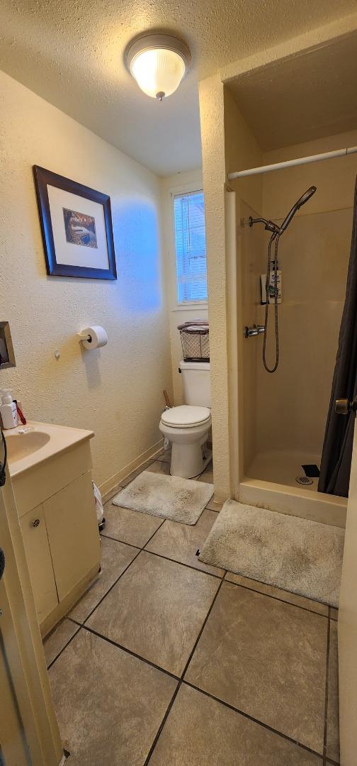 1591 Del Monte Boulevard Seaside, CA 93955 - Photo 12 of 20 a bathroom with a sink and a toilet