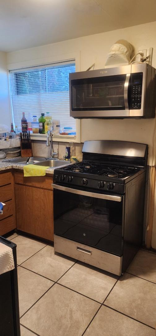 1591 Del Monte Boulevard Seaside, CA 93955 - Photo 13 of 20 a kitchen with a stove and a microwave