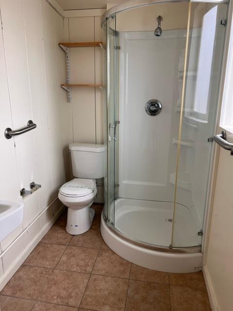 1591 Del Monte Boulevard Seaside, CA 93955 - Photo 17 of 20 a white toilet sitting next to a bath tub
