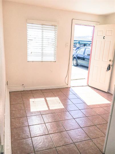 1591 Del Monte Boulevard Seaside, CA 93955 - Photo 9 of 20 a view of a livingroom with wooden floor and a window
