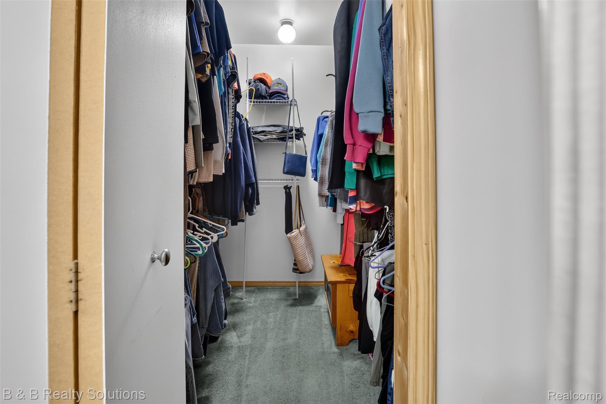 3097 East Burnside Road North Branch, MI 48461 - Photo 23 of 52 Walk-in closet featuring wire shelving, hanging rods, and light gray carpeting