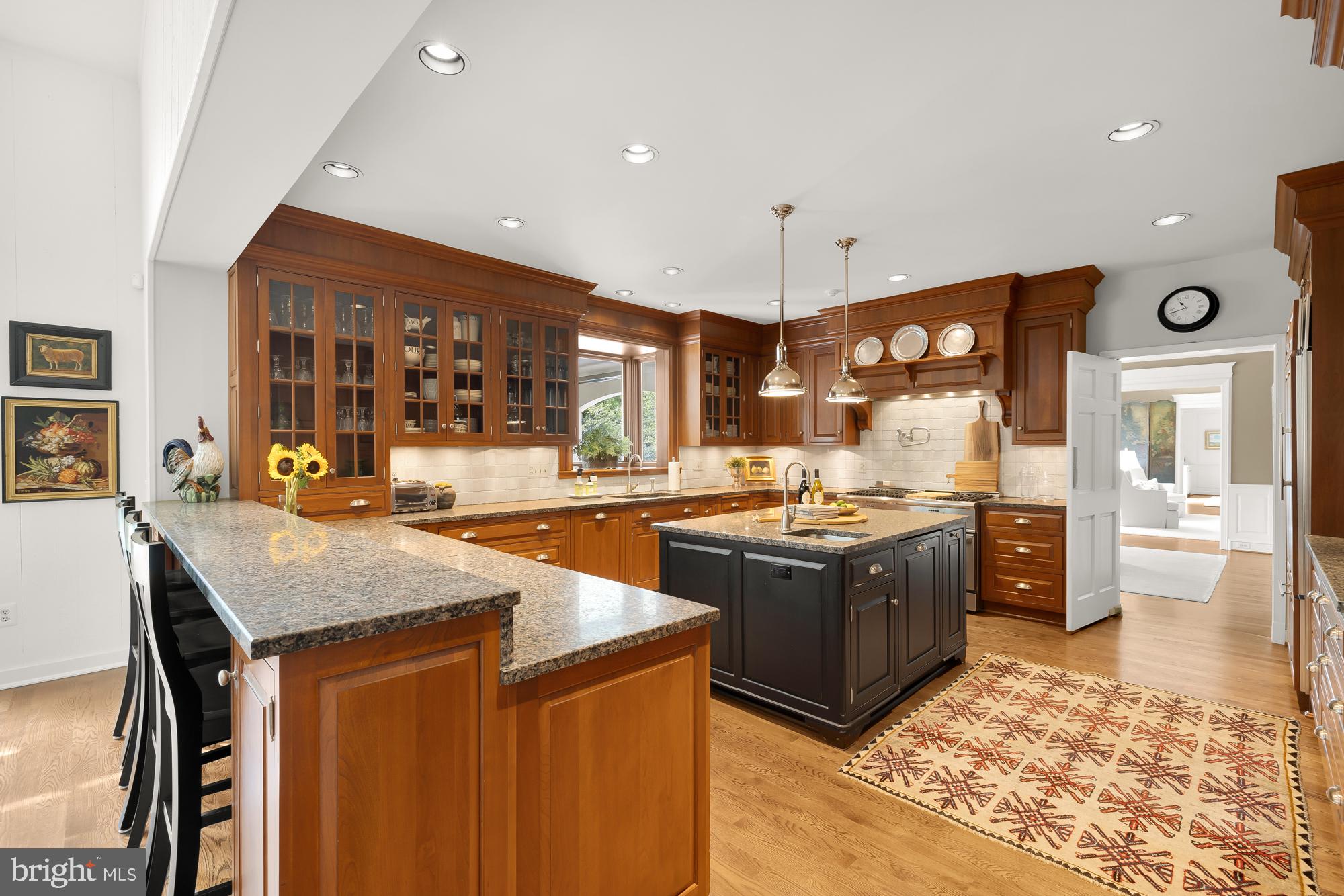 11101 Piney Meetinghouse Road Potomac, MD 20854 - Photo 14 of 96 Elegant kitchen with rich wood tones.