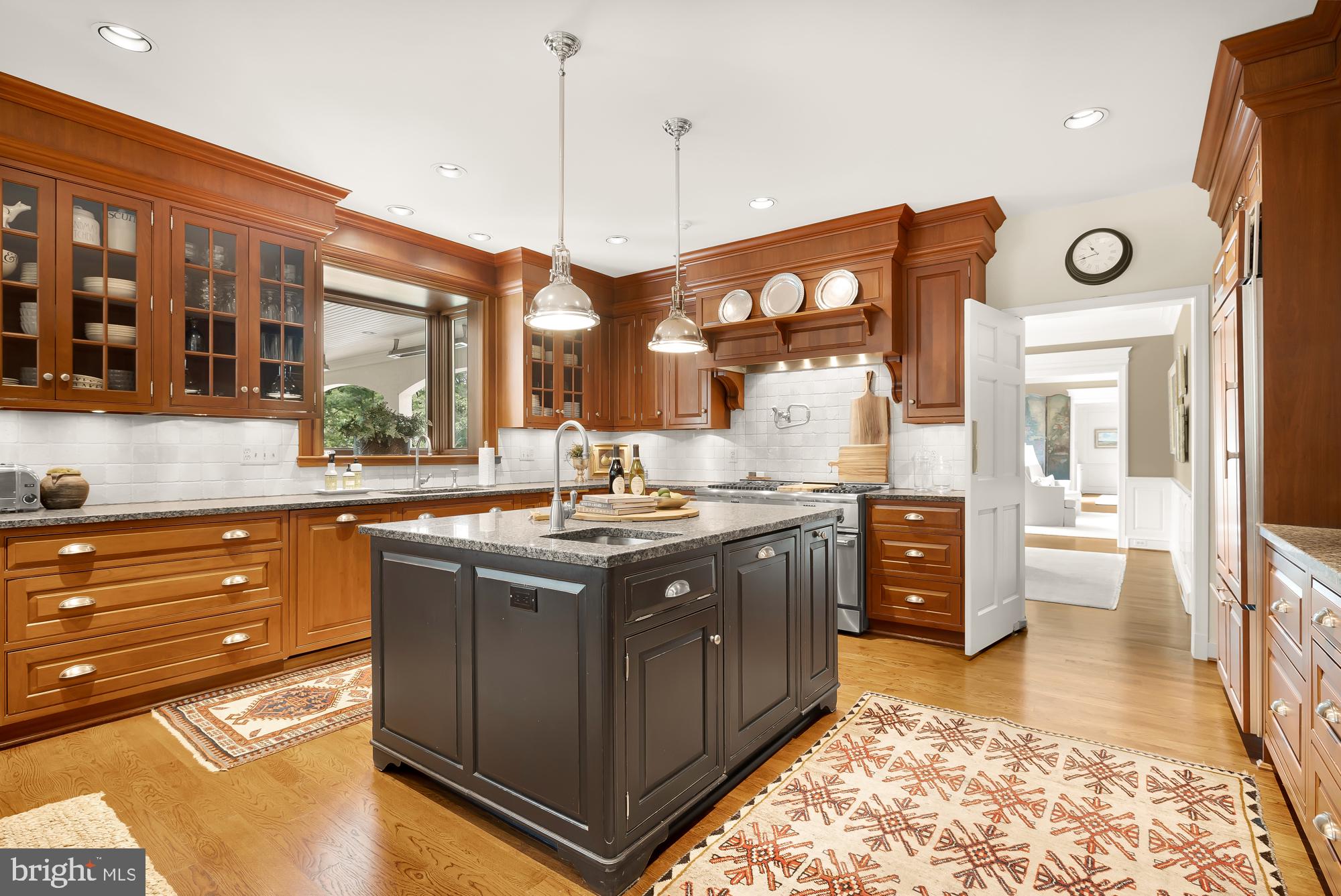 11101 Piney Meetinghouse Road Potomac, MD 20854 - Photo 15 of 96 Elegant kitchen with rich wood accents.